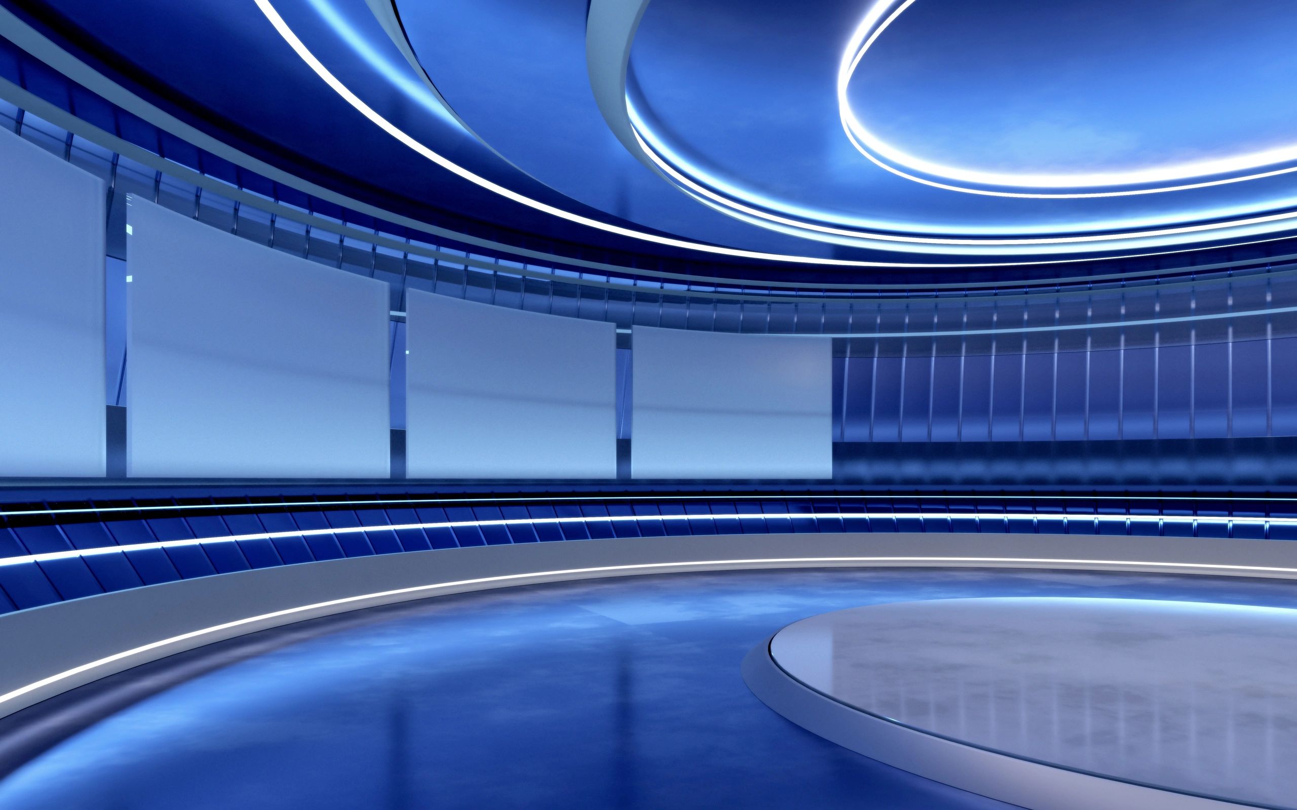 Empty television studio backdrop, with circular blue walls and bright neon lights